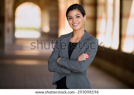 Happy successful smiling business woman executive female in a suit