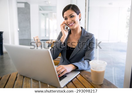 Executive business woman networking on the internet with coffee at a cafe