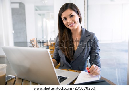 Attractive attorney law student lawyer working from her computer laptop