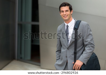Business man attorney at workplace office outside building on the go with briefcase