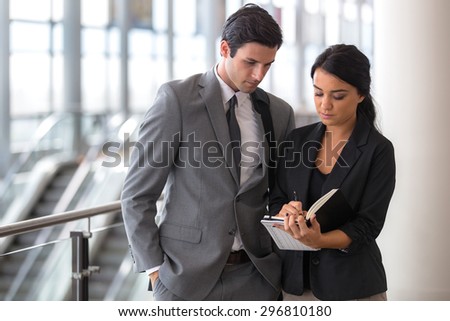 Man and woman business executive attorney in a suit team secretary leader