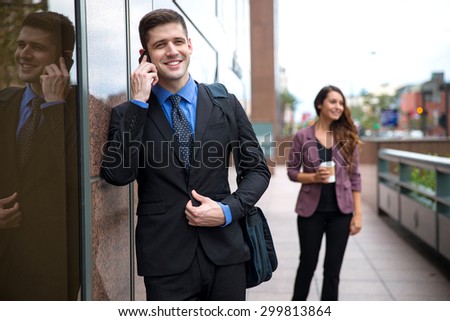 Stylish attractive male businessman networking business call technology cell phone