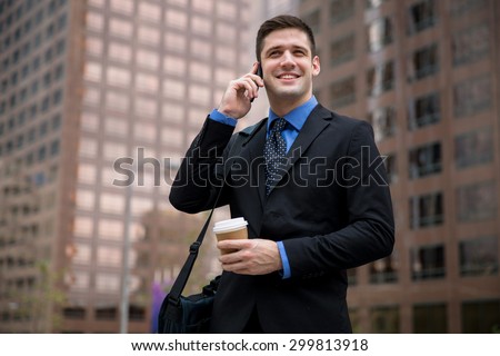 Handsome professional fresh stylish modern business man calling on cellphone with coffee