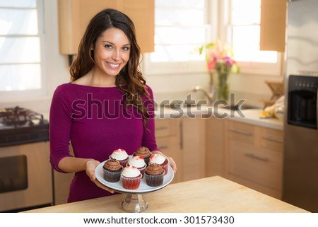 Portrait of beautiful chef home cook at home with dessert cupcakes homemade sweets