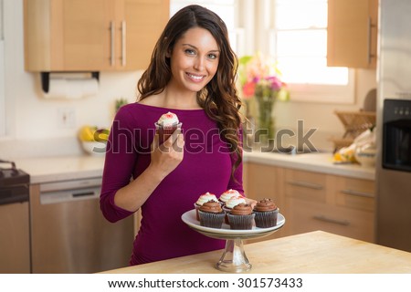 Young pretty housewife home chef baker amateur recipe cupcake dessert vegan low calorie