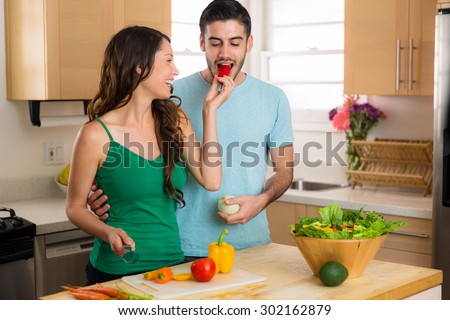 Woman feeding man a fresh vegetable salad healthy nutritious lifestyle rich in nutrients