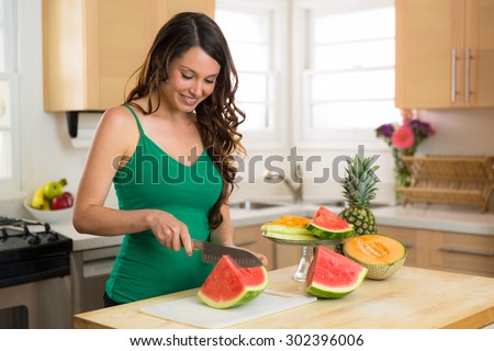 Housewife prepares a snack for her kids fruit low calorie diet nutritious organic vegan lifestyle
