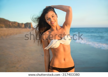 Portrait bikini swimsuit model perfect toned thin athletic body abs lifestyle cute beach smile