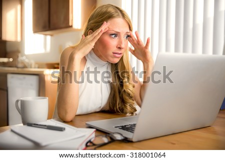 Stress frustrated panic news email reading from laptop computer woman depressed