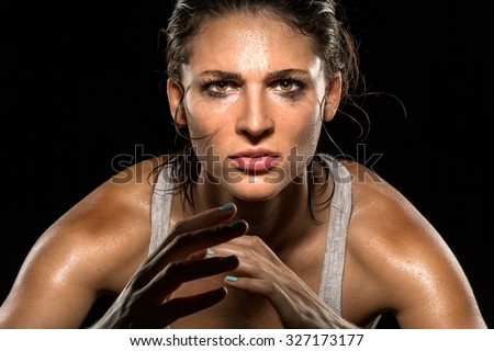 MMA fighter boxer athlete intense focus eyes wrestler strong confident woman close up