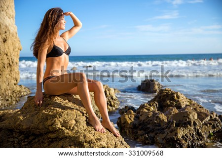 Perfect figure toned thin athletic body shape physique model bikini girl woman abs waist muscular looking out