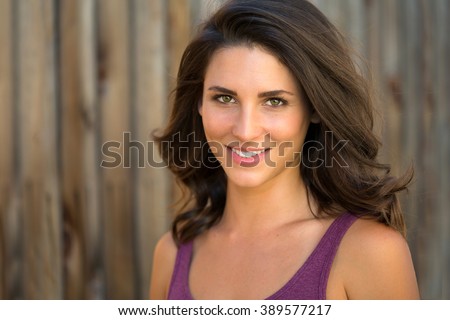Beautiful brunette model head shot outdoor perfect straight white smile latin latina mixed race