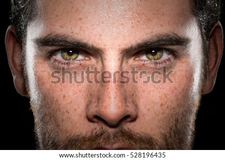 Conviction focused determined passionate confident powerful eyes stare intense athlete exercise trainer male