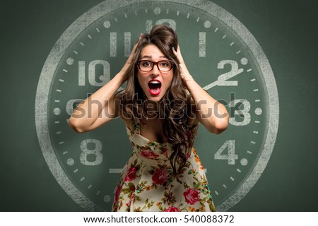 Woman freaking out in extreme anxiety panic attack, late, out of time, clock