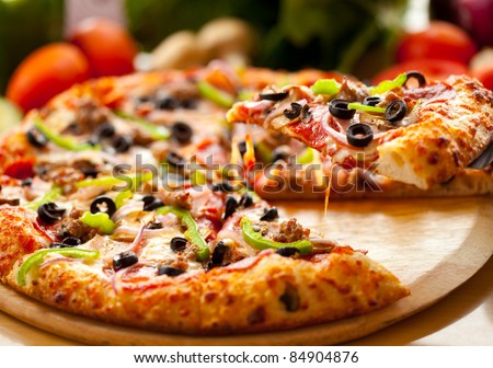 Supreme pizza lifted slice