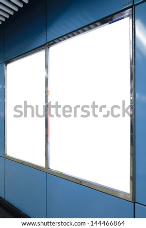 Two big vertical / portrait orientation blank billboard on blue wall