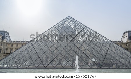 PARIS - AUG 20 : Louvre museum in summer on August 20,2013. Louvre museum is one of the world\'s largest museums with more than 8 million visitors each year.