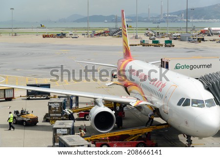 HONG KONG - MAY 16: Cargoes being unloaded from a Hong Kong Airlines at Hong Kong airport on May 16, 2014 in Hong Kong. Hong Kong Airlines is one of the most busy carriers in the region.
