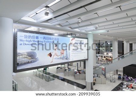 HONG KONG CHINA APRIL 14 Passengers in the airport main lobby on April 14 2014 in Hong Kong China The Hong Kong airport handles more than 70 million passengers per year HONG KONG CHINA APRIL 14 Passengers in the airport main lobby on April 14 2014 in Hong Kong China The Hong Kong airport handles more than 70 million passengers per year