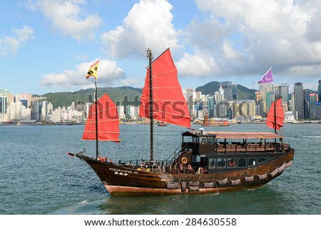 HONG KONG - MAY 8: A Junk ship in Victoria Harbor May 8, 2015 in in Hong Kong, SAR. Junk ships were used as seagoing vessels as early as the 2nd century AD.