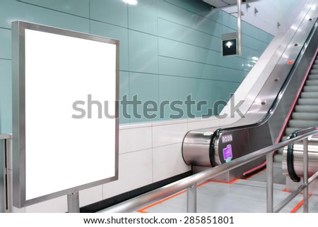 One big vertical / portrait orientation blank billboard with escalator background
