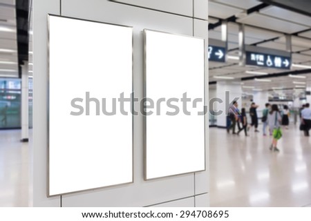 Two big vertical / portrait orientation blank billboard in public transport