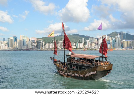 HONG KONG - MAY 8: A Junk ship in Victoria Harbor May 8, 2015 in in Hong Kong, SAR. Junk ships were used as seagoing vessels as early as the 2nd century AD.