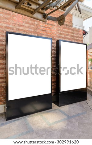 Two big vertical / portrait orientation blank billboard in park