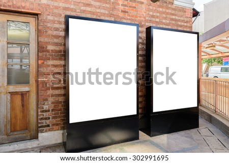 Two big vertical / portrait orientation blank billboard in park