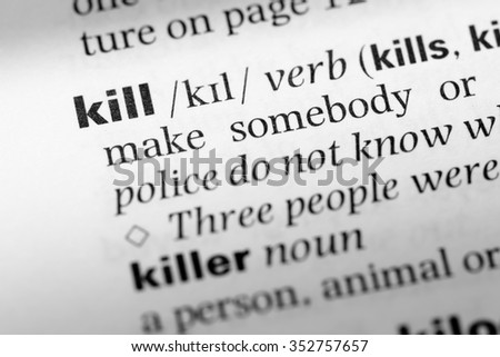 Close up of English dictionary page with word kill