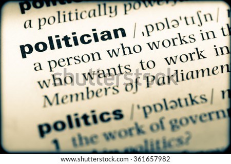 Close up of English dictionary page with word politician
