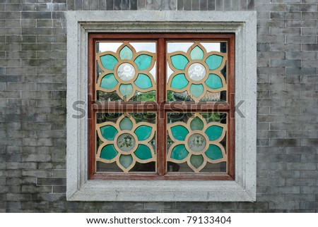 Traditional Chinese window on Chinese break wall