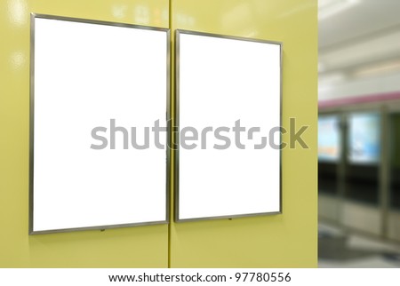 Two big vertical / portrait orientation blank billboard on modern yellow wall with platform background