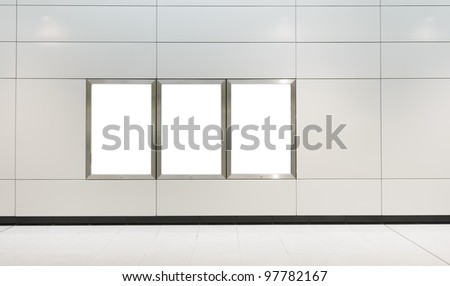 Three big vertical / portrait orientation blank billboard on modern white wall
