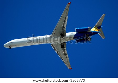 Twin engine jet plane overhead on flight path to land, fly-by, 2