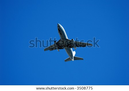 Twin engine jet plane overhead on flight path to land, landing approach 737, 3