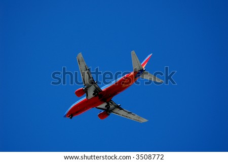 Twin engine jet plane overhead on flight path to land, overhead, 5