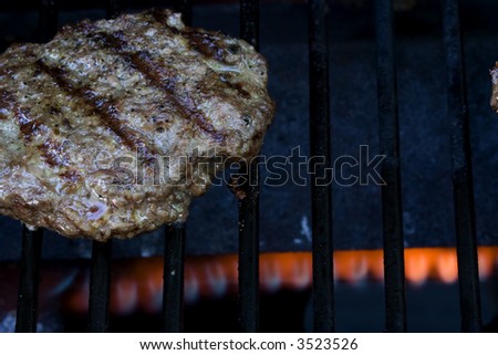 Grilling burgers on the bbq in the backyard for summer fun