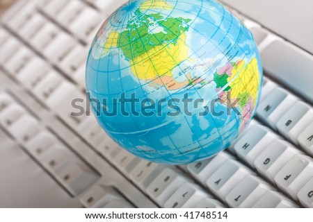 concept of the world wide web globe on a computer keyboard
