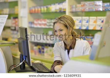 female pharmacist holding prescription