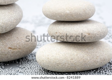 pile of river stones and small metallic balls as background