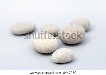 river stones on grey background