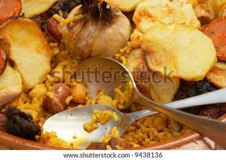 close-up of cooked spanish food with rice and vegetables