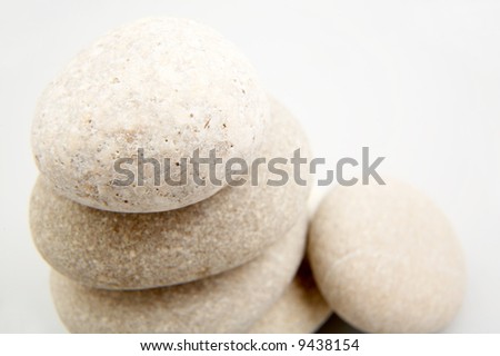 pile of river stones on white background