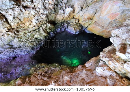 divers diving in a cavern