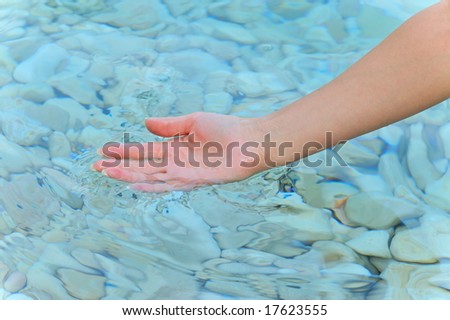 hand of a woman in the water