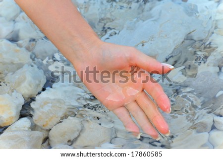 hand of a woman in the water