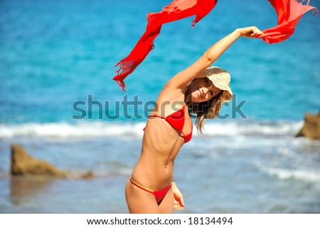 beautiful woman with scarf on the beach