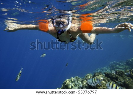 underwater image of young woman snorkeling