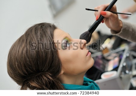 beautiful young model getting fashion make-up